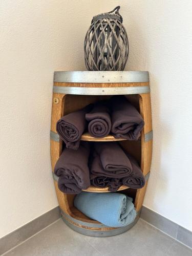 a wooden shelf with towels in a room at Feriendomizil im Saarschleifenland in Mettlach