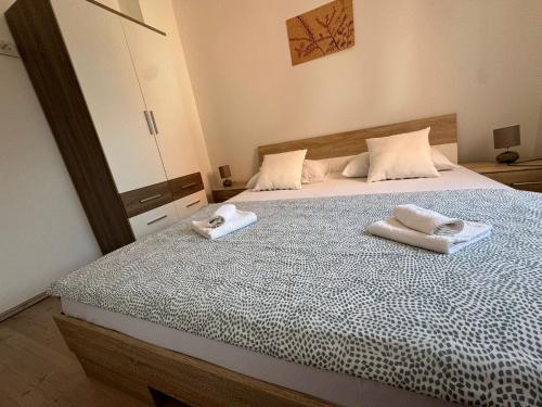 Postel nebo postele na pokoji v ubytování Apartmani "Bodulo"