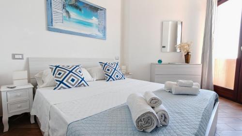 Ένα ή περισσότερα κρεβάτια σε δωμάτιο στο Blu Mare