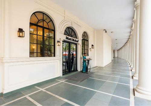 a woman standing in the hallway of a building at Saltstayz Autograph - Connaught Place in New Delhi