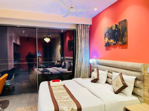 a hotel room with a bed and a table at Spira Supernova in New Delhi