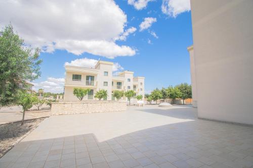 a large white house with a blue sky at Casa Bellavista in Torre Canne