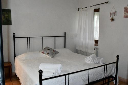 Postel nebo postele na pokoji v ubytování appartamento gelsomino