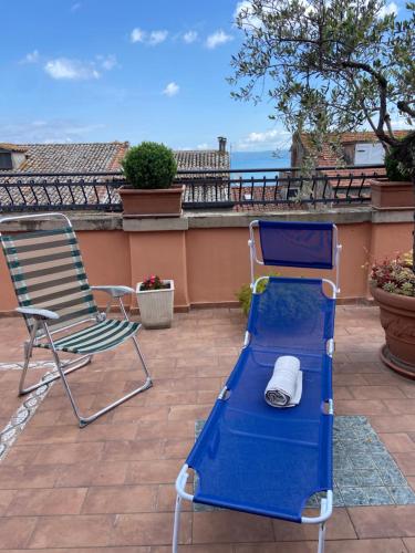 a blue trampoline and a chair on a patio at Tuscany Location in Marta
