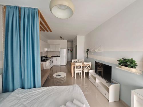 Ένα ή περισσότερα κρεβάτια σε δωμάτιο στο Caesar Resort studio Italius