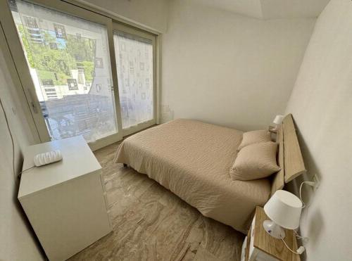 Postel nebo postele na pokoji v ubytování VILLA LUCE D'ALBA