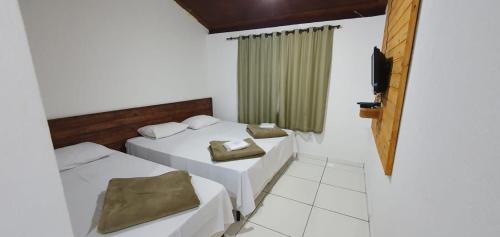 Postel nebo postele na pokoji v ubytování Pousada Serra Verde - Pousada Rural em Capitólio MG