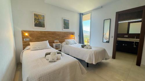 Ένα ή περισσότερα κρεβάτια σε δωμάτιο στο Villa Tierra