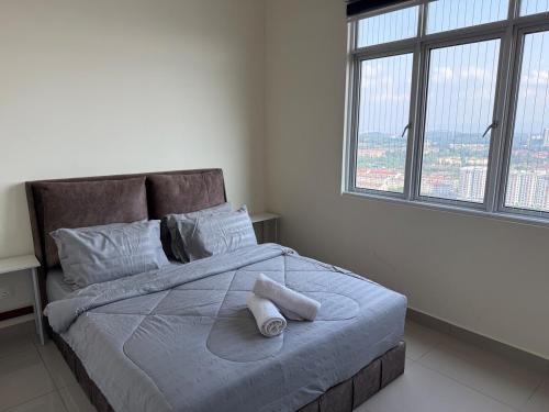 Giường trong phòng chung tại Cozy Stay Nexus Kajang Convenient City Access