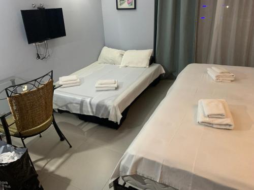 Ein Bett oder Betten in einem Zimmer der Unterkunft ORBI First Line APARTHOTEL
