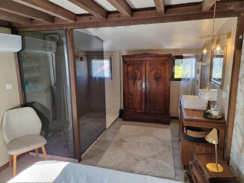Postel nebo postele na pokoji v ubytování Chalet du Badamier Blanc