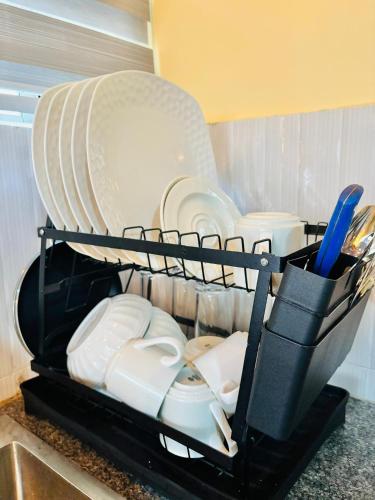 En eller flere senge i et værelse på Minzi Homes