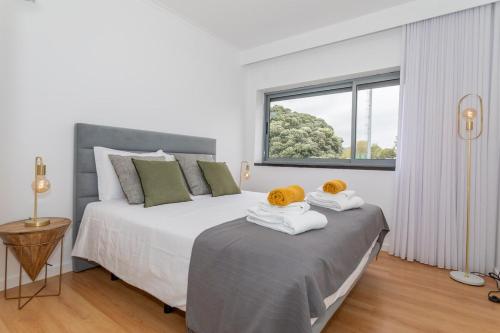 Ένα ή περισσότερα κρεβάτια σε δωμάτιο στο GuestReady - JB Comfort Flat