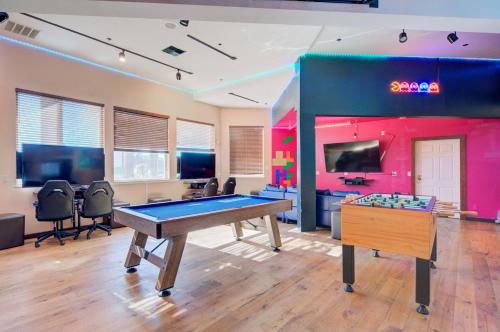 a gaming room with a pool table and a tv at Holiday Inn West Yellowstone by IHG in West Yellowstone