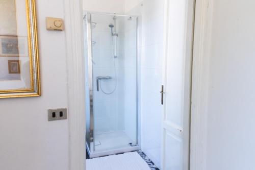 a shower in a bathroom with a glass shower stall at La Casina a Oleggio in Oleggio