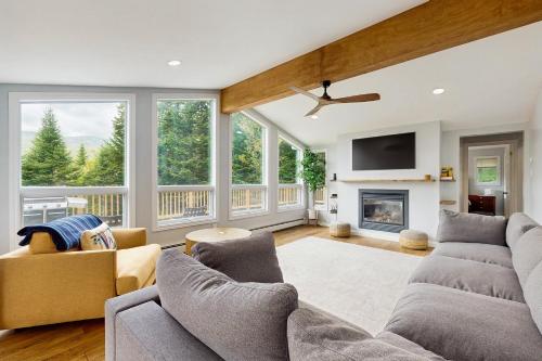 a living room with two couches and a fireplace at Ski Dreams in Dover