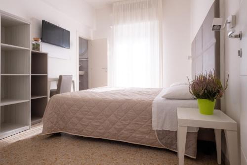 Postel nebo postele na pokoji v ubytování Hotel Silver