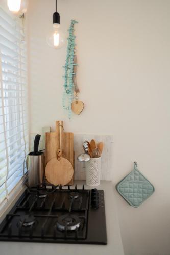 a kitchen counter with a stove top oven at Strand-chalet Luna - 700 mtr van het strand van Ouddorp in Ouddorp