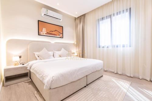 Postel nebo postele na pokoji v ubytování Amber Hospitality - Al Qairawan