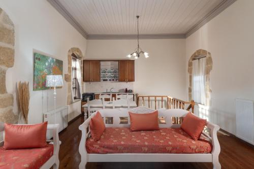 a living room with a couch and a table at Arhontiko Arhanes Suites in Archanes