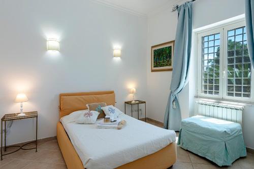 Postel nebo postele na pokoji v ubytování Villino dei Coralli