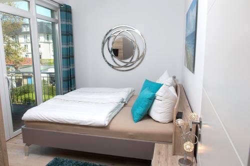 Un pat sau paturi într-o cameră la Ferienwohnung Wilma