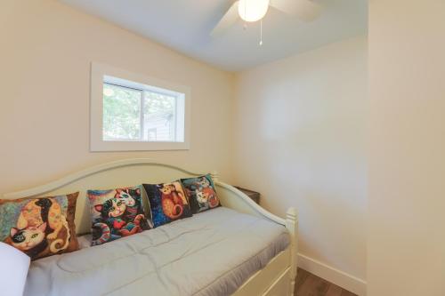 a bedroom with a bed with a window at Historic Madison Retreat - 1 Mi to Ohio River in Madison