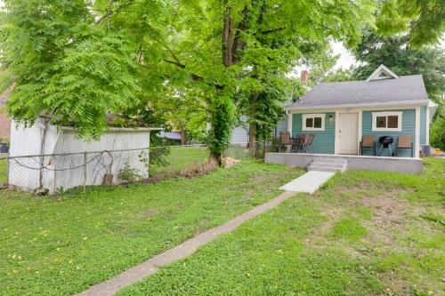 a small blue house with a table and chairs in a yard at Historic Madison Retreat - 1 Mi to Ohio River in Madison