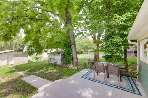 a patio with two chairs and a table in a yard at Historic Madison Retreat - 1 Mi to Ohio River in Madison