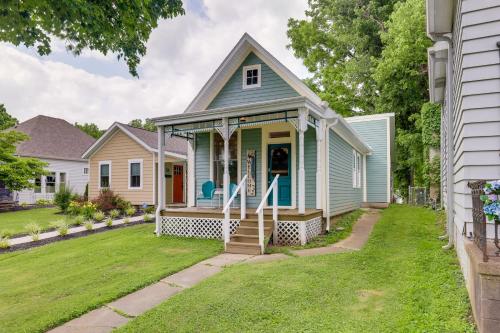 a blue house with a porch and a yard at Historic Madison Retreat - 1 Mi to Ohio River in Madison