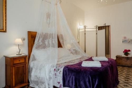 Ένα ή περισσότερα κρεβάτια σε δωμάτιο στο B&B La Casa di Fano