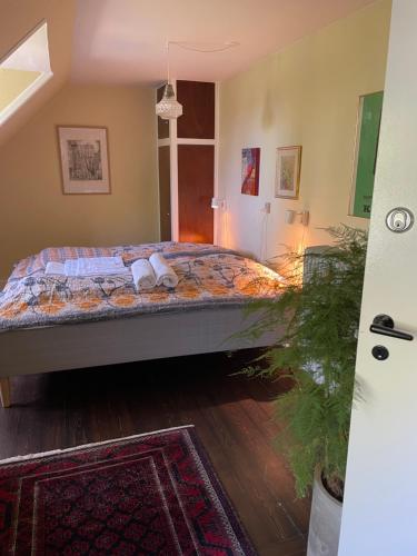 a bedroom with a bed with two pillows on it at Huset i Hejls in Hejls