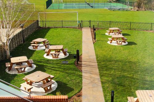 a group of picnic tables in a park at Coach & Horses Dersingham in Dersingham