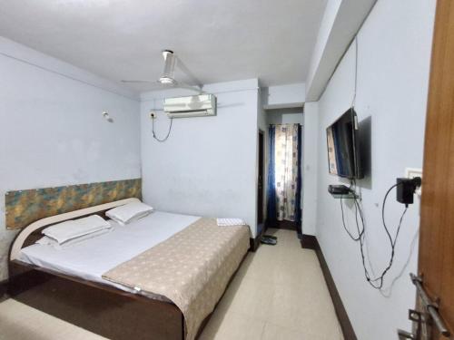 Ένα ή περισσότερα κρεβάτια σε δωμάτιο στο Hotel mountain rangpo