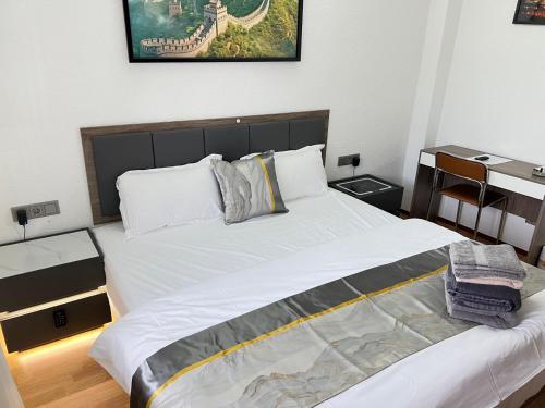 a bedroom with a large white bed in it at Ferienhaus große Villa "Smart home" in Euskirchen