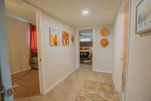 a hallway with a hallway leading to a room at Cowboy Den-Hot Tub-Game Room-Pet Friendly-No Pet Fees! in Albuquerque
