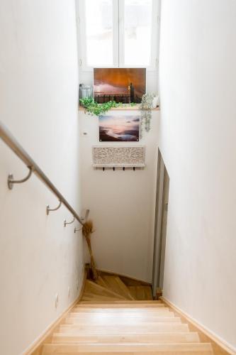 a hallway with wooden floors and a window at Ted Surf House in Capbreton