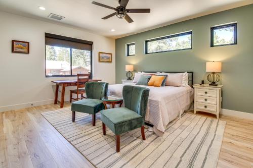 a bedroom with a bed and a table and chairs at Fireplace and EV Charger! Home in Torreon Community in Show Low