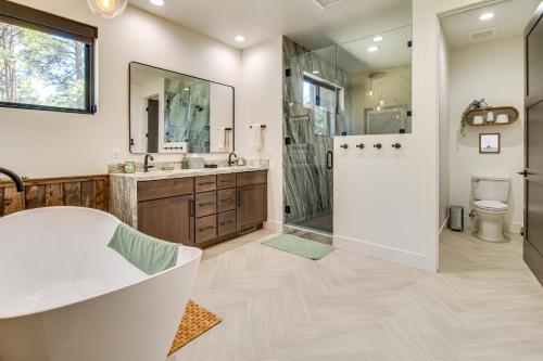 a large bathroom with a tub and a shower at Fireplace and EV Charger! Home in Torreon Community in Show Low