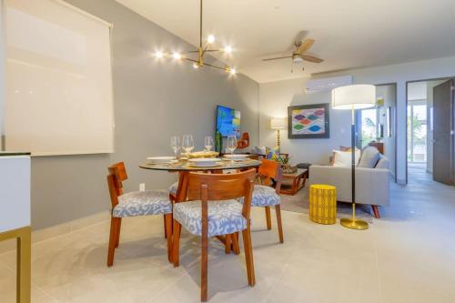 a kitchen and living room with a table and chairs at Oceanview Stay Pools Walk to Beach & Snorkel in Akumal