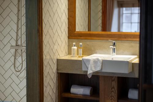 a bathroom with a sink and a mirror at The Royal Heysham in Heysham