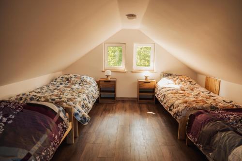 Postel nebo postele na pokoji v ubytování Zakątek Mazury Domek na Mazurach Sauna Jacuzzi