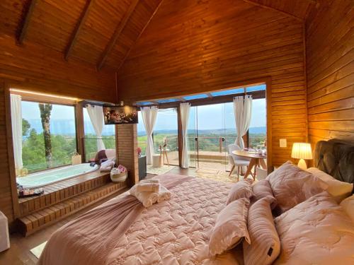 Postel nebo postele na pokoji v ubytování Chalés Santa Carolina