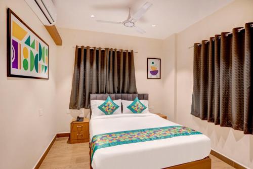 a bedroom with a bed in a room at Treebo Address Inn Gachibowli in Hyderabad
