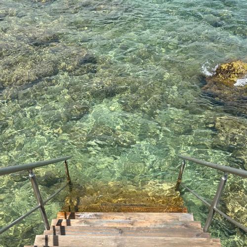 a view of the water with steps in the ocean at Nina Mia in Fasano
