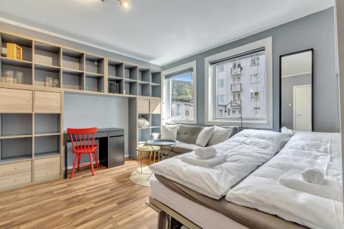 En eller flere senge i et værelse på Cozy Studio Retreat