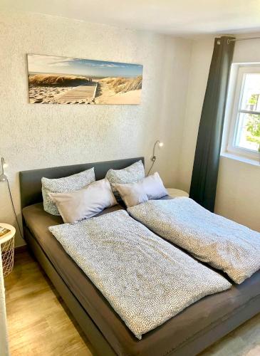Ένα ή περισσότερα κρεβάτια σε δωμάτιο στο Haus Ferienglück Sauna im Haus