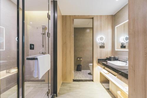 a bathroom with a sink and a toilet at Atour Hotel Shanghai Anting in Shanghai
