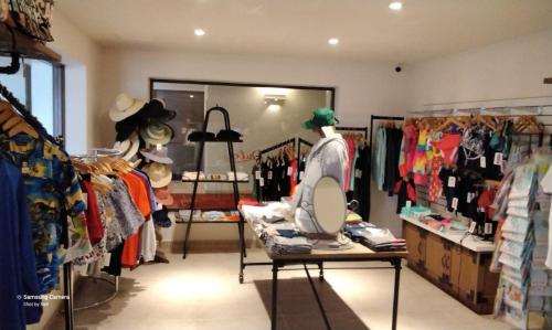 a clothing store with a dressing room with clothes on display at Beach&Golf suites in El Bedito
