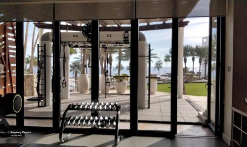a bench sitting in front of a building at Beach&Golf suites in El Bedito